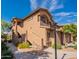 Charming two-story condo featuring well-maintained landscaping, stone accents, and private entrances at 11500 E Cochise Dr # 2088, Scottsdale, AZ 85259