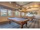 Well-lit game room with classic pool tables, decorative lighting, and comfortable seating options at 11500 E Cochise Dr # 2088, Scottsdale, AZ 85259