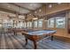 Spacious game room featuring two pool tables, recessed lighting, and charming decorative details at 11500 E Cochise Dr # 2088, Scottsdale, AZ 85259