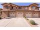 Attached two-car garages offer convenience and complement the property's facade at 11500 E Cochise Dr # 2088, Scottsdale, AZ 85259