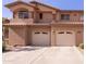 Attached two-car garage offers convenience and complements the property's facade at 11500 E Cochise Dr # 2088, Scottsdale, AZ 85259