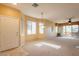 Open concept living room with ample natural light and balcony access at 11500 E Cochise Dr # 2088, Scottsdale, AZ 85259