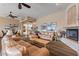 Spacious living room showcasing comfortable leather sofas, a stone fireplace, and charming decor at 11500 E Cochise Dr # 2088, Scottsdale, AZ 85259