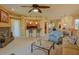 Open-concept living room showcasing fireplace, kitchen bar, and dining area, great for entertaining at 11500 E Cochise Dr # 2088, Scottsdale, AZ 85259