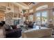 Comfortable seating surrounds a stone fireplace in this community gathering space at 11500 E Cochise Dr # 2088, Scottsdale, AZ 85259