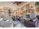Comfortable seating surrounds a stone fireplace in this community gathering space at 11500 E Cochise Dr # 2088, Scottsdale, AZ 85259