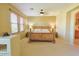 Serene main bedroom featuring a wooden bed frame, side tables, and ample natural light at 11500 E Cochise Dr # 2088, Scottsdale, AZ 85259