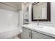 Bathroom with combination shower-tub and a modern vanity at 11520 W Lizard Ct, Surprise, AZ 85378