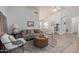 Cozy living room with stylish decor, featuring comfortable seating and an inviting atmosphere at 11520 W Lizard Ct, Surprise, AZ 85378