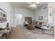 Bright living room with vaulted ceilings, modern furnishings, and lots of natural light at 11520 W Lizard Ct, Surprise, AZ 85378