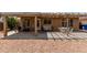 Cozy covered patio with string lights, a grill, white furniture, and a shaded area for outdoor dining at 11520 W Lizard Ct, Surprise, AZ 85378