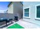 Paver backyard with a built-in BBQ, perfect for outdoor entertaining and relaxation at 12161 W Flanagan St, Avondale, AZ 85323