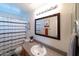 Nicely appointed bathroom showcasing a large mirror, modern vanity, and shower-tub combination at 12161 W Flanagan St, Avondale, AZ 85323