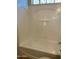 Bright and clean bathtub-shower combination with a built-in shelf at 12161 W Flanagan St, Avondale, AZ 85323