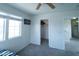Well-lit bedroom featuring neutral carpet, a ceiling fan, and a functional closet at 12161 W Flanagan St, Avondale, AZ 85323