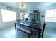 Well-lit dining room with a large table, complementary decor, and modern flooring at 12161 W Flanagan St, Avondale, AZ 85323