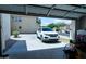 Open garage with a car parked outside and easy access to driveway and street at 12161 W Flanagan St, Avondale, AZ 85323