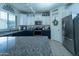 Modern kitchen features granite countertops, stainless steel appliances, and ample cabinet space at 12161 W Flanagan St, Avondale, AZ 85323