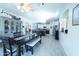 Open-concept space features a modern kitchen and a cozy dining area with stylish decor at 12161 W Flanagan St, Avondale, AZ 85323