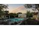 Backyard oasis with a pool, spa, covered seating area and lush desert landscaping, perfect for relaxation and entertainment at 13202 N 76Th Pl, Scottsdale, AZ 85260