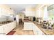 Charming kitchen with granite counters, mosaic backsplash and adjacent breakfast nook at 13823 N 99Th Dr, Sun City, AZ 85351