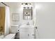 Cozy bathroom featuring a vanity with a mirror, toilet, and shower with a white curtain at 14401 N Boxwood Ln, Fountain Hills, AZ 85268