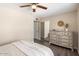Bedroom with neutral tones, dresser, and sliding door closet at 14401 N Boxwood Ln, Fountain Hills, AZ 85268