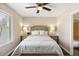 Cozy bedroom boasts a comfortable bed, side tables with lamps, and a window for ample natural light at 14401 N Boxwood Ln, Fountain Hills, AZ 85268