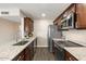 Well-equipped kitchen with granite countertops, stainless steel appliances, and modern fixtures for culinary enthusiasts at 14401 N Boxwood Ln, Fountain Hills, AZ 85268