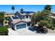 Aerial view of a home featuring solar panels, a three-car garage, and well-maintained landscaping in a suburban neighborhood at 14430 W Windsor Ave, Goodyear, AZ 85395