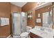 Modern bathroom featuring a glass shower and vanity with ample storage at 14430 W Windsor Ave, Goodyear, AZ 85395