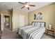 Relaxing bedroom featuring a cozy bed, neutral walls, and soft carpeting at 14430 W Windsor Ave, Goodyear, AZ 85395