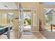 Bright foyer with tile floors, high ceilings, and an open view of the front yard at 14430 W Windsor Ave, Goodyear, AZ 85395