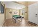 Inviting game room featuring a pool table, tile floors, and overhead lighting at 14430 W Windsor Ave, Goodyear, AZ 85395
