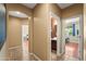 Hallway with neutral colored walls and tile flooring at 14430 W Windsor Ave, Goodyear, AZ 85395