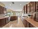 Spacious kitchen with modern appliances and access to the backyard and pool at 14430 W Windsor Ave, Goodyear, AZ 85395