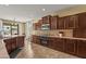 Beautiful kitchen showcasing modern appliances, dark cabinetry, and recessed lighting at 14430 W Windsor Ave, Goodyear, AZ 85395