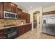 Well-equipped kitchen featuring stainless steel appliances and ample cabinet space at 14430 W Windsor Ave, Goodyear, AZ 85395
