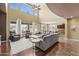 Open-concept living room boasting natural light, comfortable seating, and stylish accents at 14430 W Windsor Ave, Goodyear, AZ 85395