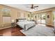 Spacious main bedroom with a ceiling fan, decorative details, and patio access at 14430 W Windsor Ave, Goodyear, AZ 85395