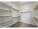 Spacious walk-in closet with custom shelving and ample storage space at 14430 W Windsor Ave, Goodyear, AZ 85395