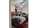Comfortable bedroom with a fan, closet, and desk at 1448 E Mobile Ln, Phoenix, AZ 85040