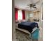 Cozy bedroom featuring a plush bed, bright window, and vibrant red curtains at 1448 E Mobile Ln, Phoenix, AZ 85040