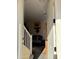 Inviting entryway with a view into the living space, showcasing a dog sitting calmly on the sofa at 1448 E Mobile Ln, Phoenix, AZ 85040