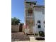 Exterior shot showcasing a two-story home with a small front balcony, accented by an American flag at 1448 E Mobile Ln, Phoenix, AZ 85040