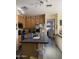 Functional kitchen with modern appliances, spacious island, and convenient access to the living area at 1448 E Mobile Ln, Phoenix, AZ 85040