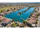 Expansive lake winds through a Primary planned community, offering waterfront living, and desert landscaping at 1506 W Laurel Ave, Gilbert, AZ 85233
