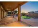 Covered back patio next to an outdoor pool at 1506 W Laurel Ave, Gilbert, AZ 85233