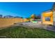 This home has a grassy backyard, pool, and covered patio at 1506 W Laurel Ave, Gilbert, AZ 85233