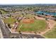 Aerial shot of baseball fields inside residential neighborhood with landscaping and ample parking at 1506 W Laurel Ave, Gilbert, AZ 85233